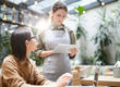 waitress taking person's order using mobile point of sale