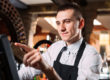 waiter using restuarant point of sale system
