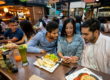woman using app to pay in restaurant (1)